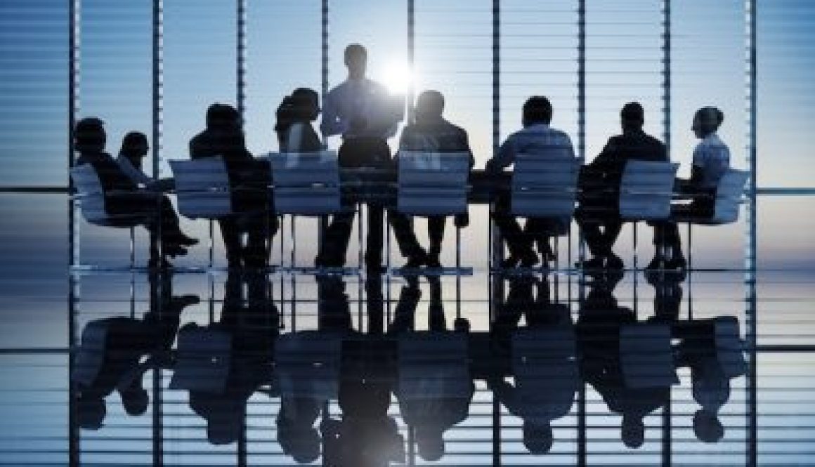 Business people in a board room meeting